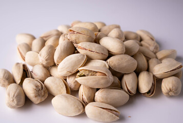 salted pistachios on a white background