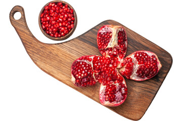 Fresh Pomegranate Pieces on Wooden Cutting Board.