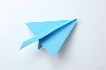 Blue Paper Airplane on White Background Origami Flat Lay