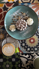 Cookies and coffee served in Ibiza cafe