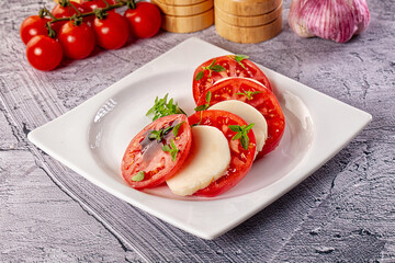 Italian caprese salad with mozzarella, tomato and basil