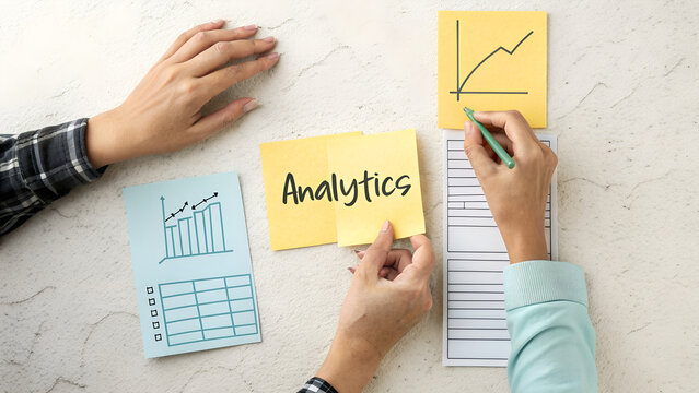 Team analyzing business growth and data with sticky notes and charts on a wall