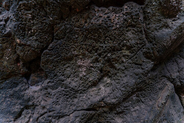Natural volcanic rock surface displaying unique textures and patterns in a geothermal region
