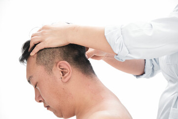 Fototapeta premium A professional massage therapist gives a body massage to a man.