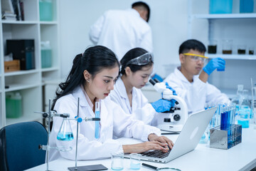 In the laboratory, several researchers and scientists, each focused on their own biology experiments, conduct detailed analysis to advance the field of science and deepen understanding.