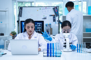 In the laboratory, several researchers and scientists, each focused on their own biology experiments, conduct detailed analysis to advance the field of science and deepen understanding.