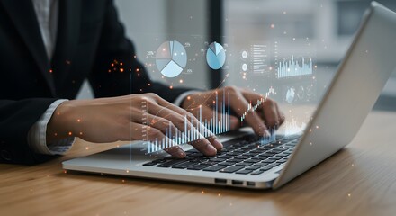 Business professional analyzing financial data on a laptop with holographic charts and graphs
