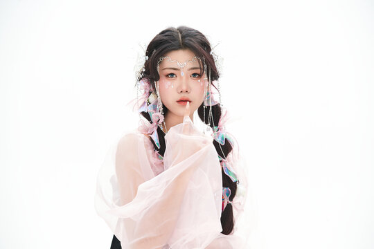 An Eastern girl dressed in the traditional costume of the Hani ethnic minority, which is popular among online influencers.