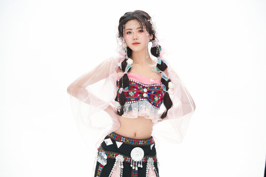 An Eastern girl dressed in the traditional costume of the Hani ethnic minority, which is popular among online influencers.