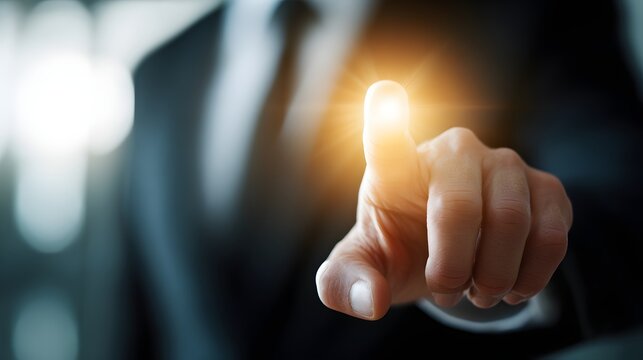 A person's fingertip points to a highlighted spot.
