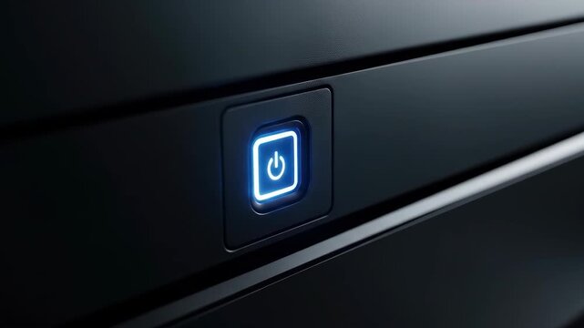 Illuminated blue power button on black device, turning on technology, system concept.