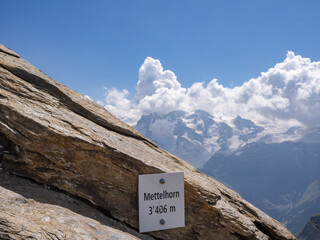Mettelhorn, Switzerland - August 24th 2024: Arrival at the summit, the 2nd highest Swiss peak with a hiking trail