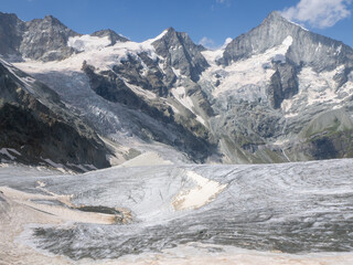 Mettelhorn, Switzerland - August 24th 2024: Impressive view from the summit towards Weisshorn peak.