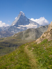 Zermatt, Switzerland - August 24th 2024: Untypical view to Matterhorn peak, seen from the hiking trail to Mettelhorn