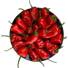 Vibrant red chili peppers arranged on a dark speckled plate.