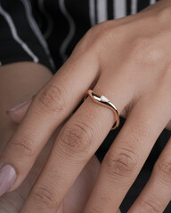 Gold Diamond engagement ring for women and girls lifestyle image with model hand 