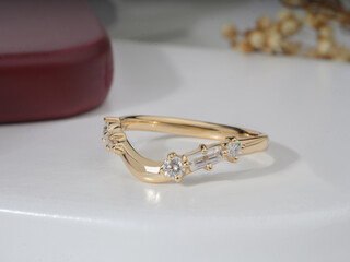 Gold Diamond engagemenet ring for women isolated in white podium 