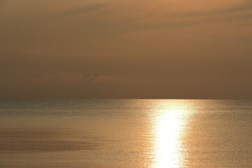 Sunrise over the sea, morning clouds