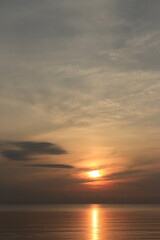 Sunrise over the sea, morning clouds