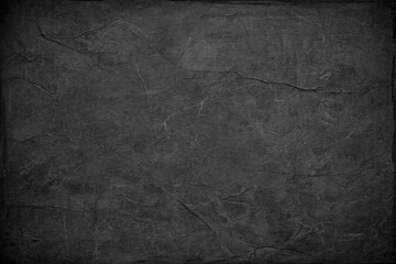 Dark gray stone surface with prominent texture