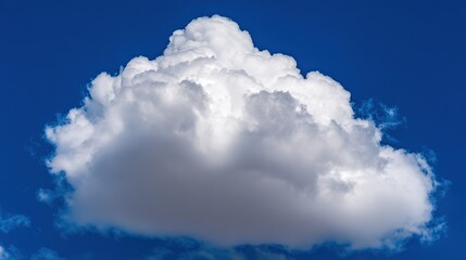 Fluffy cumulus cloud in blue sky, embodying peace and vastness of summer