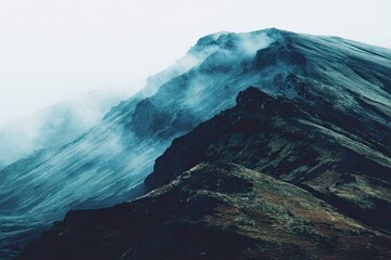 Misty mountain peak, dramatic landscape