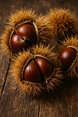 Shiny chestnuts in prickly husks on a wooden table, warm closeup for autumn harvest, cooking, and food projects.