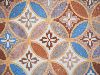Colorful Decorative Tile Mosaic with Floral and Geometric Elements