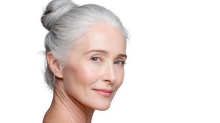 Portrait of an elegant older woman with gray hair and a serene expression, isolated on a white background.