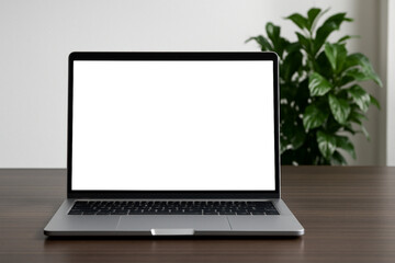 Fototapeta premium Laptop with blank white screen for mockup on a wooden desk in a cozy, sunlit home office setting.