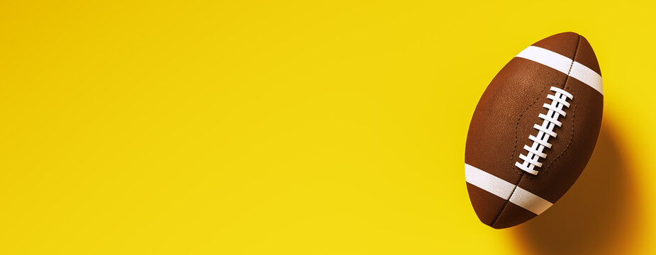 Closeup of american football ball with leather texture placed on vibrant yellow gradient background for branding or poster design mockup concept. 3D Rendering
