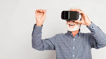 Senior man with gray beard wearing virtual reality headset, smiling and waving hand, showcasing modern technology and immersive experience in a bright indoor setting - Powered by Adobe