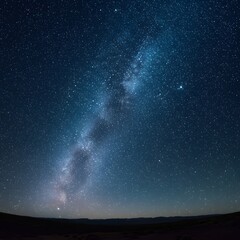 Deep blue cosmos filled with countless stars and the majestic Milky Way galaxy. An awe-inspiring celestial skyscape over a tranquil horizon.