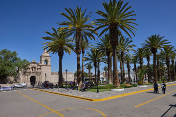 Fototapeta premium In the Yanahuara neighborhood of Arequipa, narrow sillar-lined streets, whitewashed walls, and leafy plazas create a serene atmosphere,