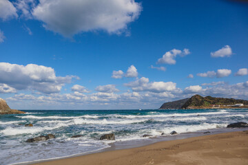 White Torii Gate Standing in the Sea at Futamigaura, Itoshima, Japan Under Blue Sky