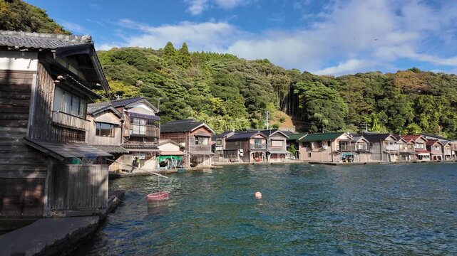 Beautiful late afternoon sight in Ine Bay, with the typical Funaya boat houses. Kyoto, Japan.
