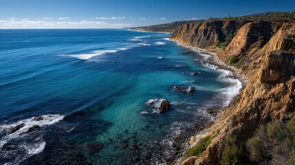Fototapeta premium Scenic Cliffside View Overlooking the Ocean on a Clear Day
