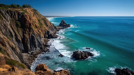 Obraz premium Serene Cliffside View Overlooking the Ocean on a Clear Day