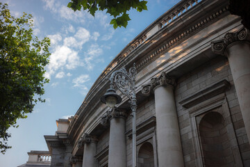 Neo-classical building facade with ornate columns and decorative stonework. Historic Dublin...