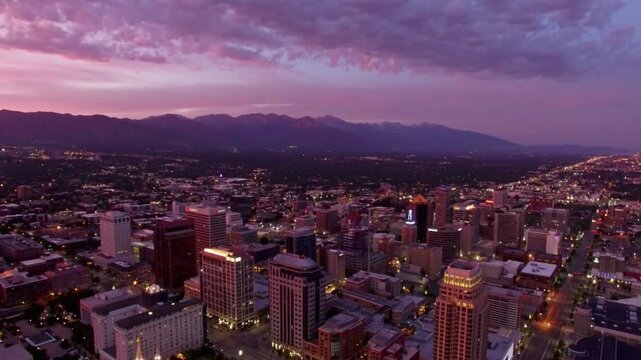 Cityscape skyline view of salt lake city utah at sunset with mountains in background