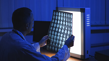 Doctor and MRI. MRI of the patient's head. High-quality photo.