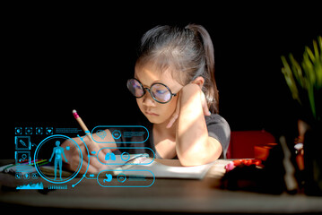  A focused young girl wearing round glasses writes in her notebook, with a futuristic blue holographic health monitoring interface displayed in front of her.