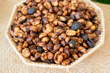 Coffee beans showing various stages of roasting from raw