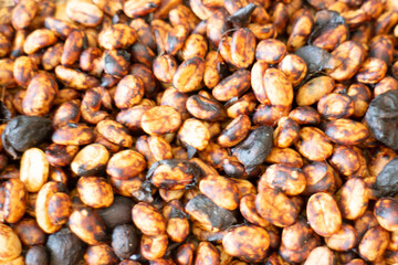 Coffee beans showing various stages of roasting from raw