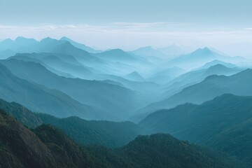 Obraz premium Serene misty mountain range unveiling layers of verdant peaks under a softly hued sky