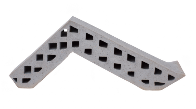 Unique architectural element featuring zigzag design with cut out patterns, made from concrete. This piece showcases modern design aesthetics and can be used in various construction projects