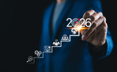 2026 New Year Business Goals Concept. Businessmen point to 2026 on a staircase, steps toward achieving business goals, growth, and success in the new year. Planning and challenge, investors target,