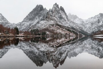 Fototapeta premium Snowy peaks reflected in a calm lake