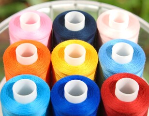 Colorful spools of thread in a circular arrangement