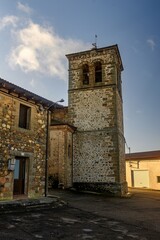 Obraz premium Bell tower of San Pedro Church in Pino del Rio village, Palencia